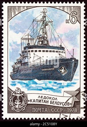 USSR - CIRCA 1978: A stamp printed in USSR from the 'Soviet Ice Breakers' issue shows Kapitan Belousov, circa 1978. Stock Photo