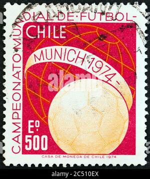 CHILE - CIRCA 1974: A stamp printed in Chile from the 'World Cup Football Championships, West Germany' issue shows ball and Globe, circa 1974. Stock Photo
