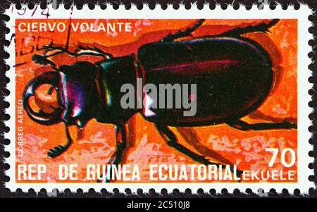 EQUATORIAL GUINEA - CIRCA 1978: A stamp printed in Equatorial Guinea from the 'Insects' issue shows Lucanus cervus, circa 1978. Stock Photo
