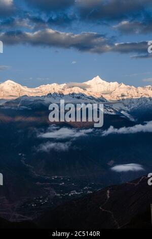 The sunrise at Meili Snow-capped mountain, a sacred mountain in Tibet, China. Stock Photo