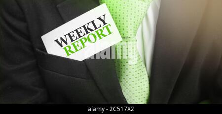 Weekly report on card in upper businessman suit pocket. Financial reports business concept Stock Photo
