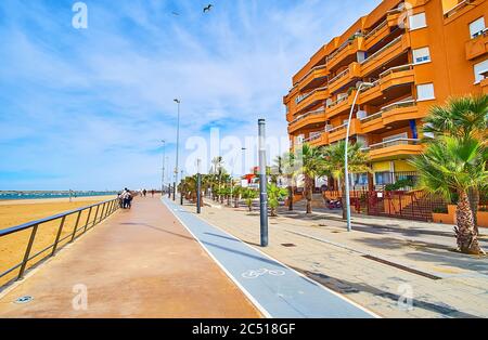 Walk the riverside promenade, stretching along Calzada beach on Guadalquivir river, Sanlucar, Spain Stock Photo