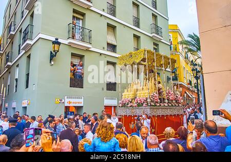 CADIZ, SPAIN - SEPTEMBER 22, 2019: Religious procession of Mercedes Fiesta (Festival of Our Lady of Mercy) with statue of Our Lady in canopied palanqu Stock Photo