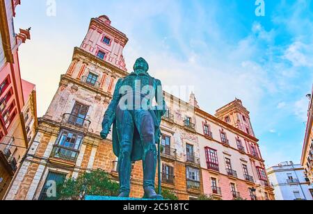 The bronze monument to Francisco de Miranda in front of Casa de las Cuatro Torres (House of Four Towers) historical mansion, Plaza Arguelles square, C Stock Photo
