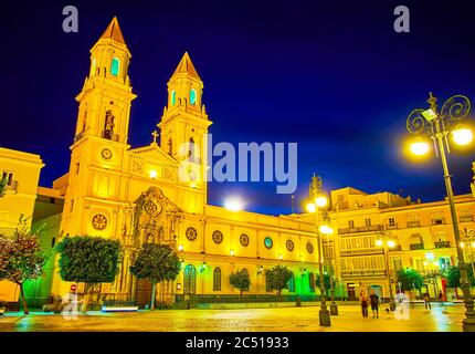 The facade of St Anthony of Padua church in bright evening lights, Plaza de San Antonio square, Cadiz, Spain Stock Photo