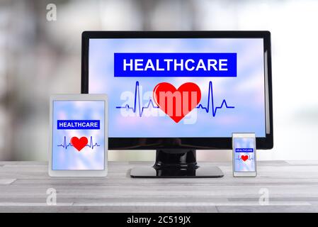 Healthcare concept shown on different information technology devices Stock Photo