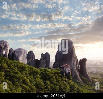 sunset on monastery Agias Varvaras Roussanou on top of rock Meteora, Greece Stock Photo