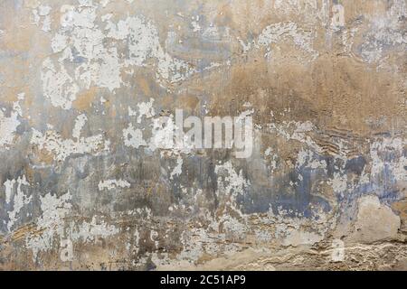 Background weathered grey concrete wall with peeled off paint Stock Photo