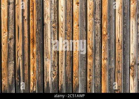 Background, rustic, weathered brown orange and black wooden wall Stock Photo