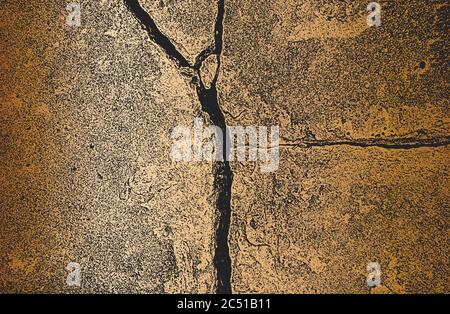 Distressed old cracked concrete vector texture. EPS8 illustration. Black and golden grunge background. Stone, asphalt, plaster, marble. Stock Vector