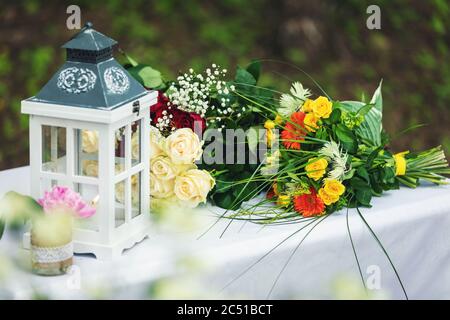 wedding decorations and flowers on the table outdoors Stock Photo