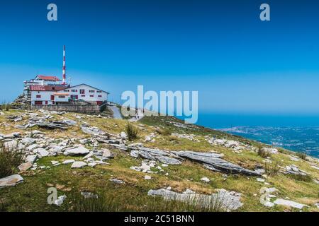 Inn and transmission antenna on the Rhune mountain in the Pyrenees Atlantiques in France Stock Photo