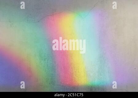 holographic lighting reflected on concrete wall. Stock Photo
