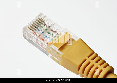 Close up of yellow network cable isolated on white Stock Photo