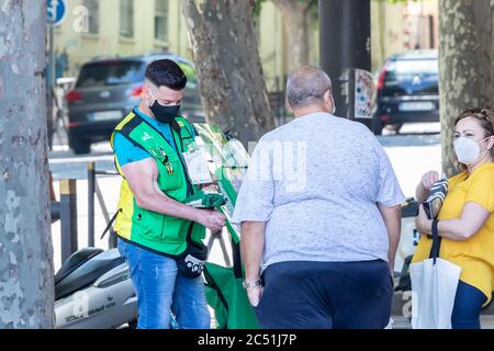 Jaen, Spain - June 18, 2020: Blind or disabled man selling lottery tickets for helping blind people.  'Once' organization Stock Photo