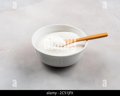 Collagen protein powder in bowl on marble Stock Photo