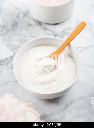 Collagen protein powder in bowl on marble Stock Photo