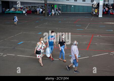 Two women walking in an almost emp Stock Photo
