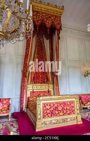 Versailles, France - August 27, 2019 : Bedroom inside The great Trianon Palace situated in the northwestern part of the Domain of Versailles. Was the Stock Photo