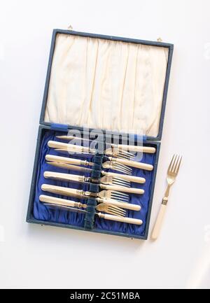 vintage canteen of cutlery on plain studio background Stock Photo