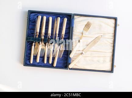 vintage canteen of cutlery on plain studio background Stock Photo