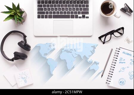 Global economy. Collage with world map, laptop computer and office stationery on white background, top view Stock Photo