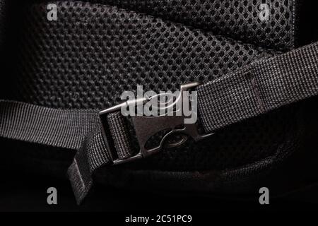Plastic clasp on a black backpack closeup Stock Photo