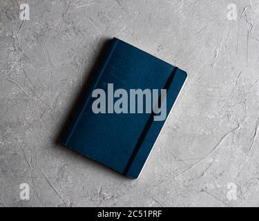 Overhead shot of a notebook on a gray background Stock Photo