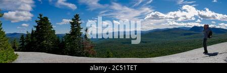 Senior man taking photo view on top of Mt Pemigewasset rocky plateau, White mountains, New Hampshire, USA Stock Photo