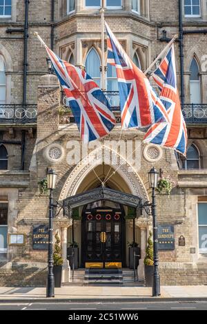 Union jacks billowing in the breeze outside The Randolph Hotel, Oxford, which is due to reopen after the Covid-19 lockdown on July 4th 2020. Stock Photo