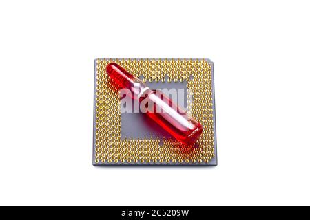 glass transparent ampoule with a red medical fluid lying on a cpu processor with contact legs on theme of health care and cyberization technologies is Stock Photo
