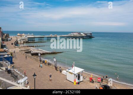 Traditional English seaside town, view in summer of the esplanade and Edwardian era pier in the seaside town of Cromer, Norfolk, England, UK Stock Photo