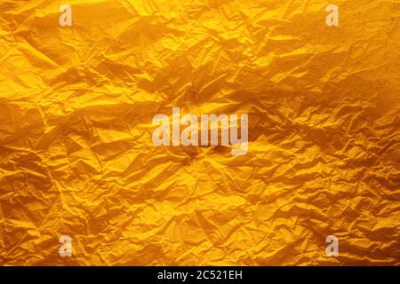 Abstract yellow crumpled paper texture for background or backdrop use Stock Photo