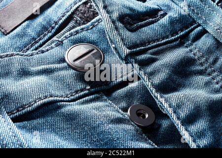 Denim or blue jeans front button. Close up macro view. Stock Photo