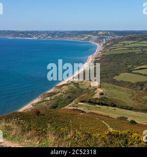 the fine view on a summers day along the Jurassic coast and South West Coast Path in Dorset from the Golden Cap looking toward Lyme Regis Stock Photo