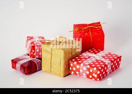 Colorful miniature gift boxes on white background. Stock Photo