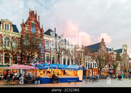 GRONINGEN, THE NETHERLANDS - NOVEMBER 2, 2017: Fish market stall on the Dutch Vismarkt square during sunset in Groningen, The Netherlands Stock Photo