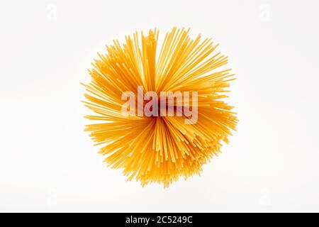 Raw spaghetti pasta on white background. Directly above or overhead view. Stock Photo