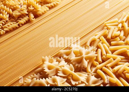 Heap of various raw pasta or macaroni in different types and shapes. Stock Photo