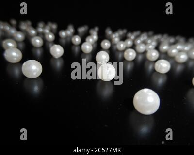 pearls on black background.