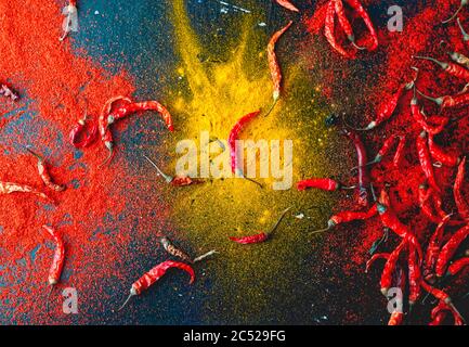 Colorful indian spices Red chillies and turmaric powder on table. Stock Photo