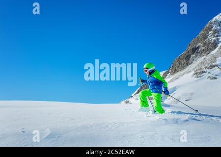 Boy in hiking school stepping on virgin snow winter activity concept Stock Photo