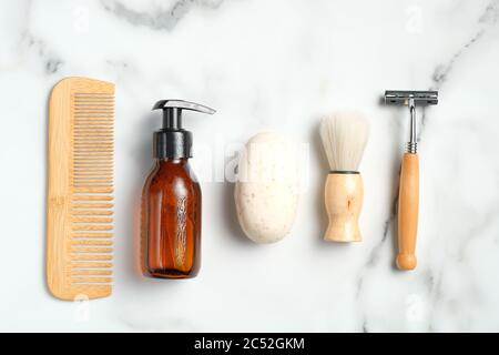 Set of eco-friendly wooden shaving accessories on marble background. Flat lay, top view. Stock Photo
