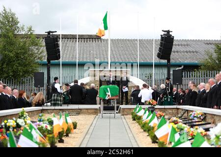 Belfast, Northern Ireland, UK. 30th June, 2020. Former Sinn Fein President Gerry Adams addresses mourners at Milltown Cemetery in west Belfast for the funeral of veteran republican Bobby Storey who died last week in England. Thousands lined the streets on Tuesday as funeral took place of former leading IRA figure as it made it way from his home in Andersonstown to the nearby Chaple of St.Agnes in west Belfast. Credit: Irish Eye/Alamy Live News Stock Photo