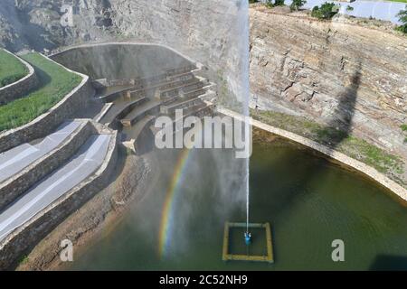 Ulanhot, China's Inner Mongolia Autonomous Region. 30th June, 2020. A corner of a man-made lake is seen at Tianjun Mountain scenic spot in Ulanhot City, north China's Inner Mongolia Autonomous Region, June 30, 2020. Tianjun Mountain, located in the suburb of Ulanhot, was once cratered and lack of vegetation due to the extraction of stones in the past time. In recent years, the local government is committed to ecological restoration and has transformed the barren mountain into a scenic spot to boost local tourism. Credit: Bei He/Xinhua/Alamy Live News Stock Photo