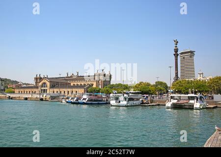 View across the harbour towards the city including the Columbus Monument, Aduana Building and the old customs building at Port Vell, Barcelona, Spain. Stock Photo