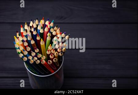 Various Colored Pencils isolated on black background. Macro Stock Photo