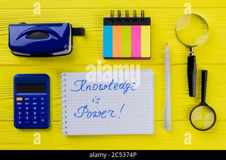 Knowledge is power phrase written on the notepad paper. Stock Photo