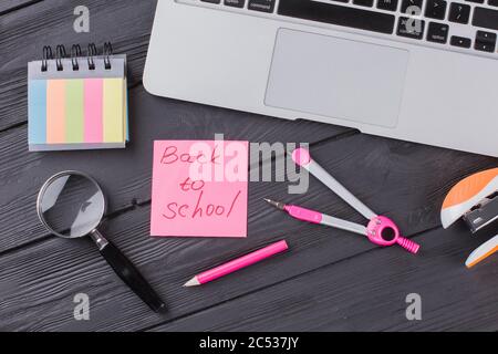 Stationary clerical items on the dark wooden table. Stock Photo