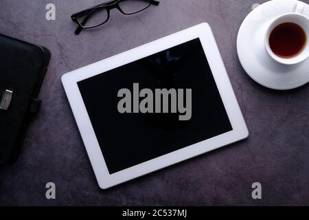 Flat composition of digital tablet and notepad on wooden background  Stock Photo